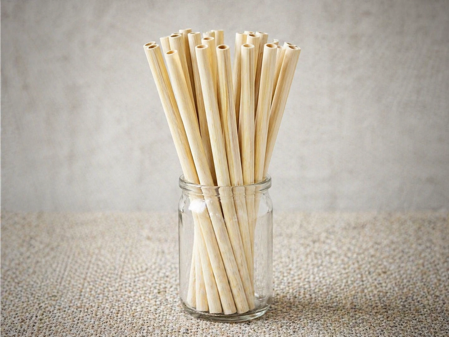 Bamboo straws displayed in glass jar for hospitality use